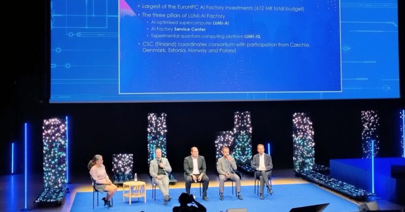 Image: Pekka Manninen (2nd from left), Director of the LUMI AI Factory, presenting the LUMI AI Factory at the EuroHPC User Days 2025.